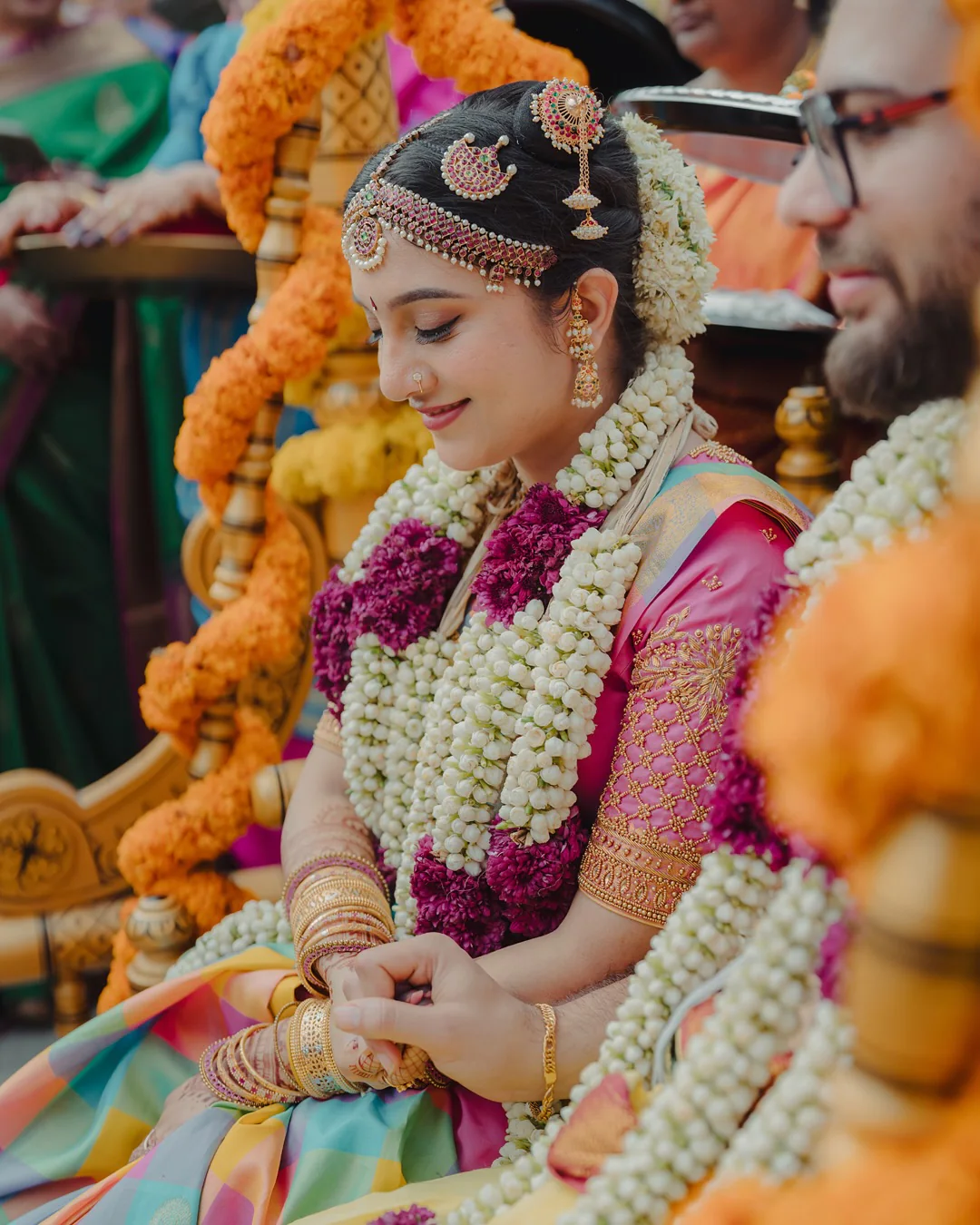 A bride smiling during her traditional wedding ceremony